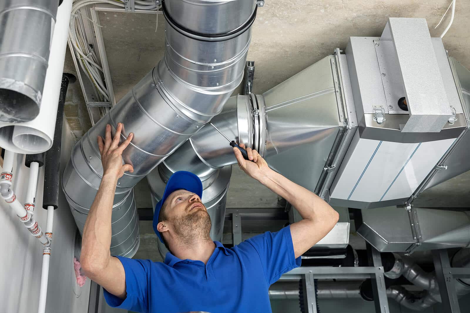 HVAC technician inspecting and repairing air ducts in Los Angeles