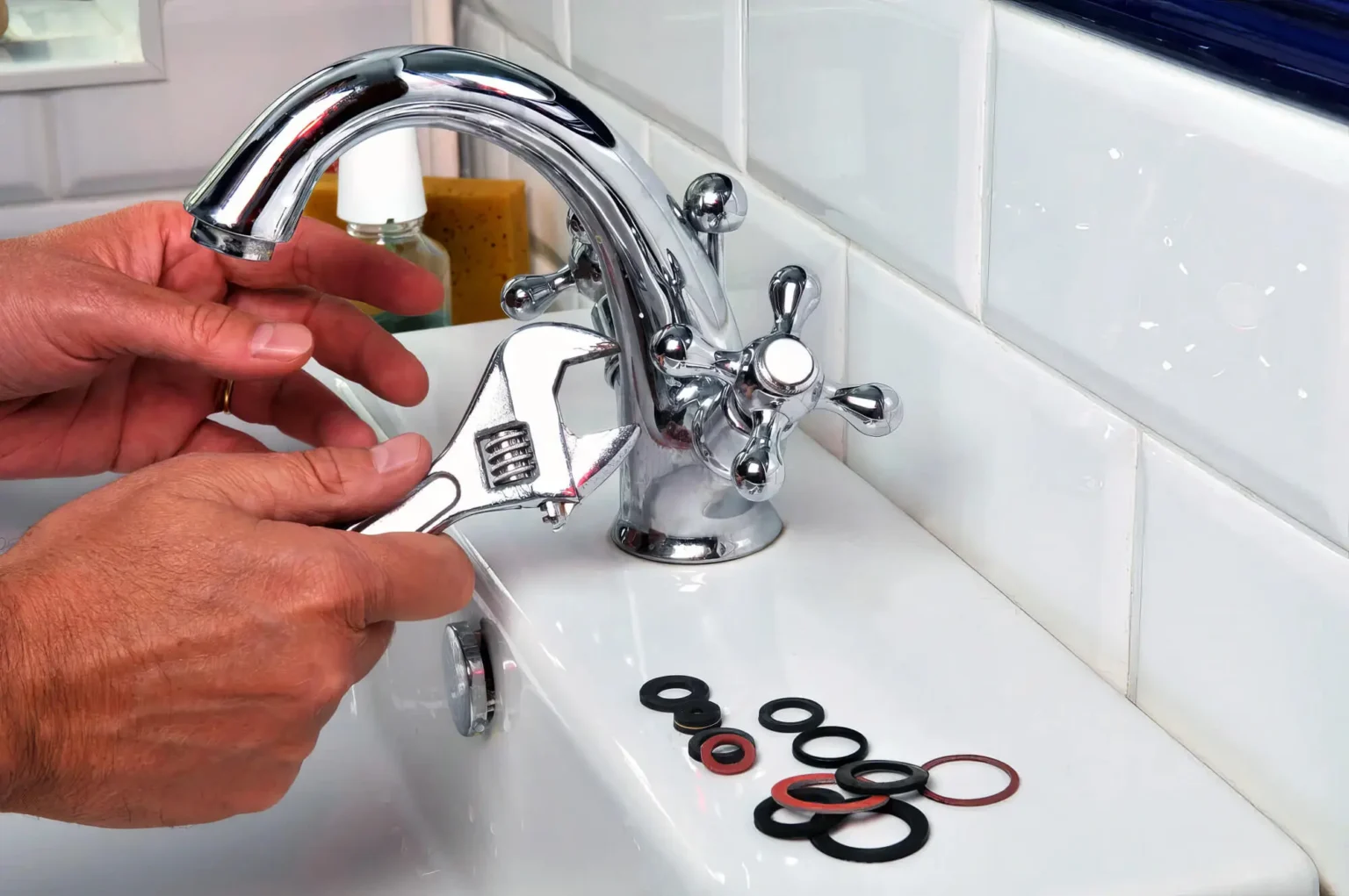 Plumber maintaining a bathroom faucet in Los Angeles