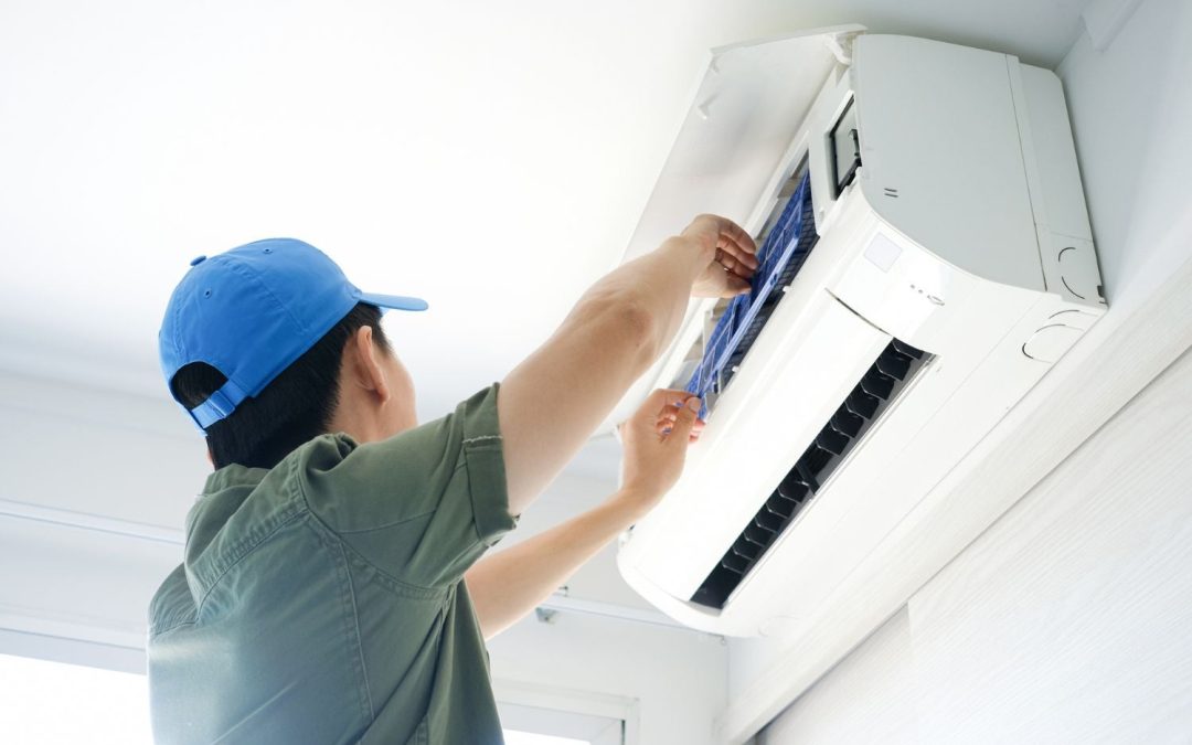HVAC technician servicing a ductless mini split in Los Angeles