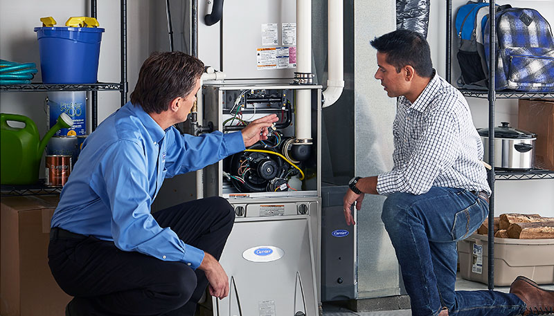 Technician evaluating a furnace for repair or replacement in Los Angeles