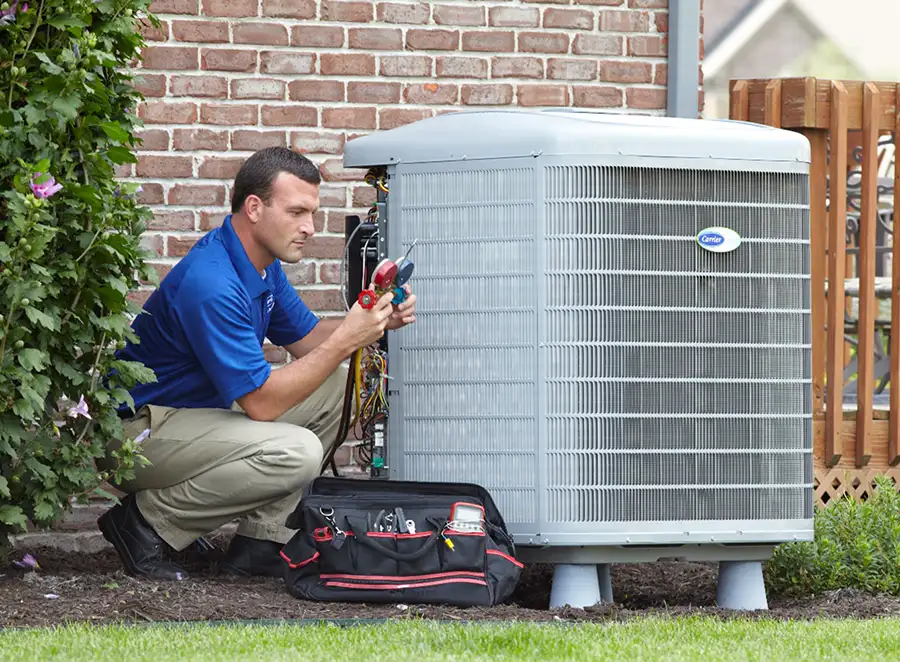 HVAC technician inspecting an outdoor AC unit in Los Angeles